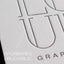 Detail of embossed letterpress design on a business card, showcasing tactile printing for a unique impression.